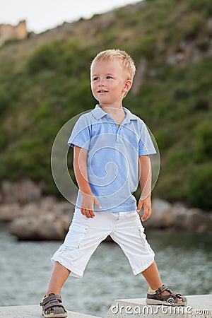 Portrait of little pretty boy on beach, summer Stock Photo
