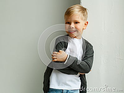 Portrait of little smiley pretty boy over white background Stock Photo