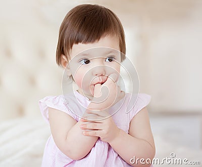 Portrait of a little sweet girl at home, close-up Stock Photo