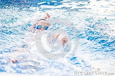 Portrait of a little swimer at the pool Stock Photo