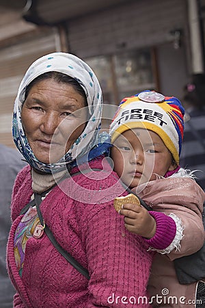 Portrait local woman with child on the street in Leh, Ladakh. India Editorial Stock Photo