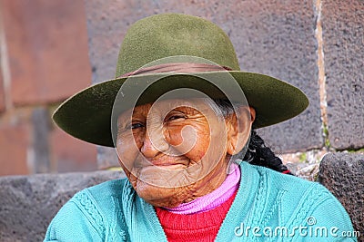 Portrait of a local woman sitting in the street of Cusco, Peru Editorial Stock Photo