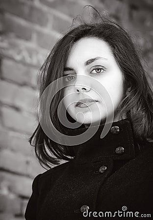 Portrait of a long-haired girl in a coat Stock Photo