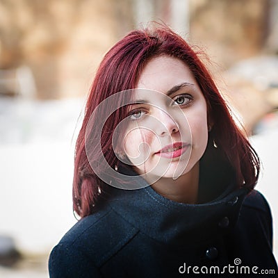 Portrait of a long-haired girl in a coat Stock Photo