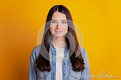 Portrait of lovely cheerful positive girl on yellow background Stock Photo