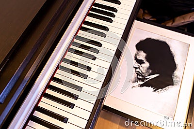 Portrait of Ludwig Beethoven next to the piano keyboard. The concept of the anniversary of the birth of the famous composer. Editorial Stock Photo