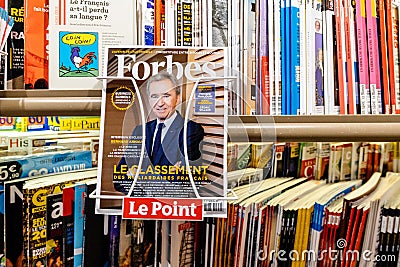 Portrait of LVMH owner Bernard Arnault at press kiosk on Forbes Editorial Stock Photo