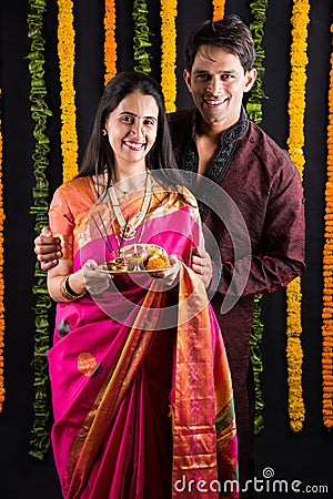 Indian couple with puja / pooja thali Stock Photo