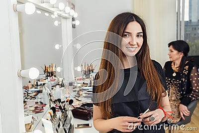 Portrait of makeup artist in beauty salon Stock Photo