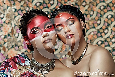 Portrait, makeup and tribal of women for culture, tradition and heritage celebration in studio. Creativity, girls and Stock Photo