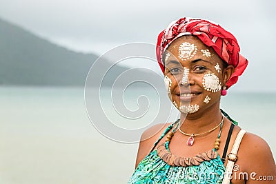 Malagasy woman with her face painted, Vezo-Sakalava tradition, Nosy Be, Madagascar Stock Photo