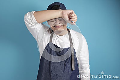 Portrait of male Asian chef or waiter crying hard, bad restaurant business concept Stock Photo