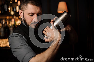 Portrait of male bartender with shaker in his hands Stock Photo