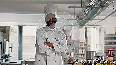 Portrait of male chef with arms crossed working in restaurant kitchen Stock Photo