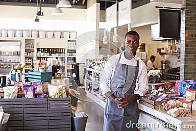 Portrait Of Male Employee Working In Delicatessen Stock Photo