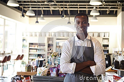 Portrait Of Male Employee Working In Delicatessen Stock Photo