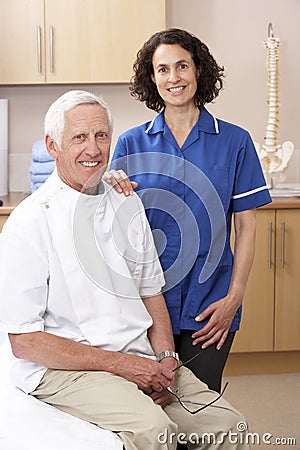 Portrait of male and female osteopath Stock Photo