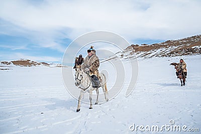 Portrait of a male hunter on horseback with a hunting golden eag Editorial Stock Photo