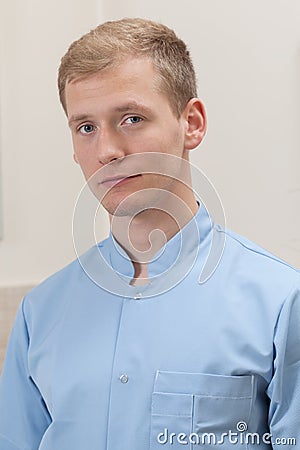 Portrait of a male masseur in blue apron Stock Photo