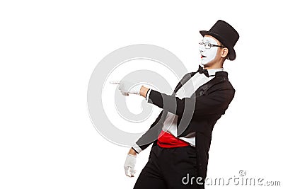 Portrait of a male mime artist performing, isolated on white background. Symbol of mockery, taunt, joke, laugh Stock Photo