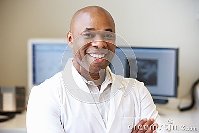 Portrait Of Male Obstetrician In Hospital Stock Photo