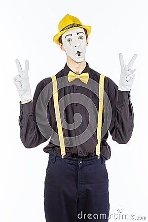 Portrait of a male, pantomime actor looking at camera and showing thumb up. Stock Photo