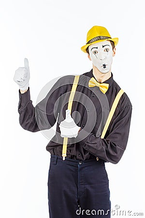 Portrait of a male, pantomime actor looking at camera and showing thumb up. Stock Photo