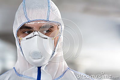 Portrait of man in coronavirus hazmat, mask and glasses Stock Photo