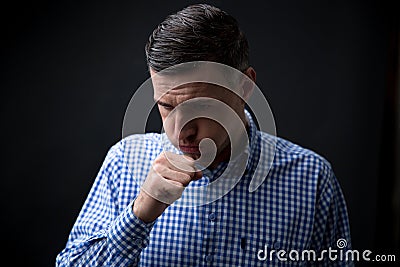 Portrait of a man coughing Stock Photo