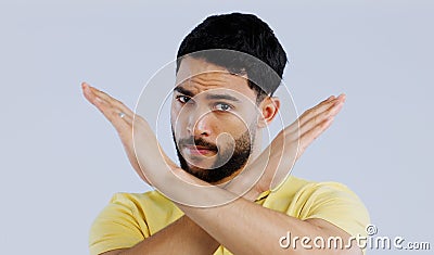 Portrait, man and cross sign for stop, no and protest for rejection, ban and wrong emoji in studio on white background Stock Photo