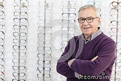 Portrait of man in frame glasses shop Stock Photo