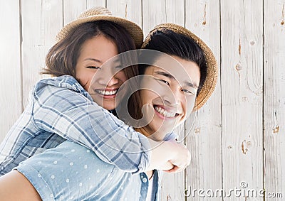 Portrait of man giving piggy back to woman Stock Photo