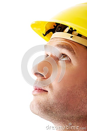 Portrait of a man with hardhat looking up Stock Photo