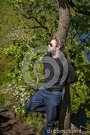 Portrait of a Man looking on view of Vltava river horseshoe shape from Maj viewpoint in Czech republic Stock Photo