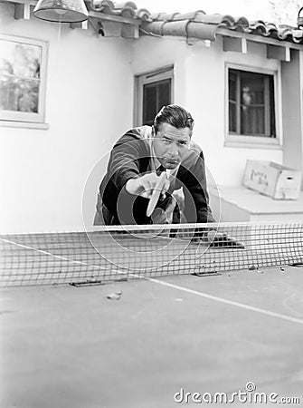 Portrait of a man playing table tennis Stock Photo