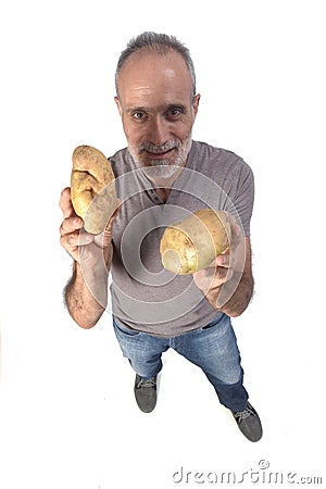 Portrait of a man with pototoes on white background Stock Photo