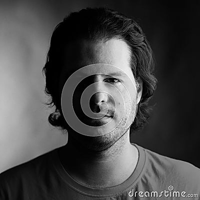 Portrait of a man shot on analog medium format film. Analogue film photography and grain concept Stock Photo