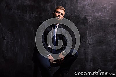 Portrait of a man sitting on a chair Stock Photo