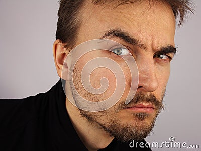 Portrait of a man, suspicious look, closeup Stock Photo