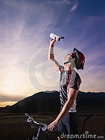 Portrait of man training on mountain bike Stock Photo