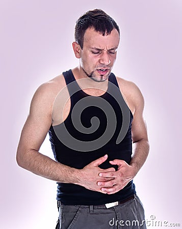 Portrait of man who has stomach pain Stock Photo