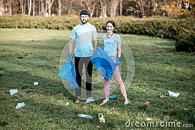 Volunteers cleaning public park from the rubbish Stock Photo