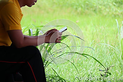 Portrait of a man& x27;s hand touching a smartphone. Social play concept. Stock Photo