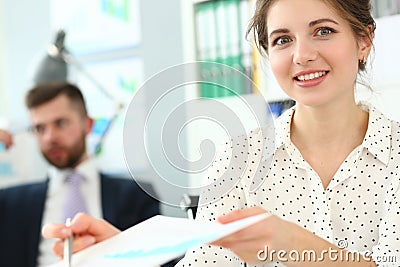 Manager give paper to boss to sign, good secretary, reliable worker Stock Photo