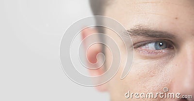 Portrait of Mans eye with grey background Stock Photo