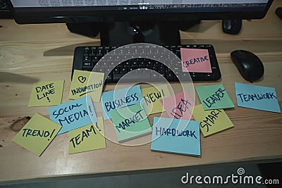 Portrait of many paper note on the table in front of monitor computer Stock Photo