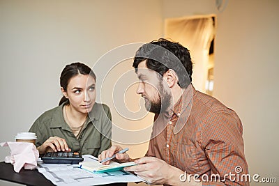 Couple Calculating Budget for New House Stock Photo