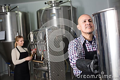 Portrait of mature glad male brewery worker Stock Photo