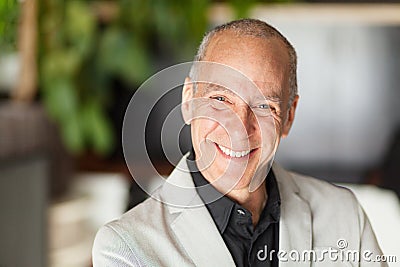 Portrait Of A Mature Man Smiling At The Camera. Elderly happy man. Stock Photo