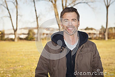 Portrait of A Mature Man Smiling At The Camera Stock Photo